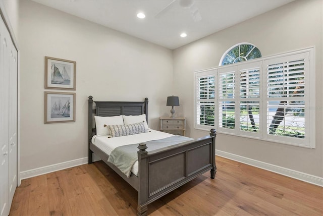 bedroom featuring recessed lighting, wood finished floors, and baseboards