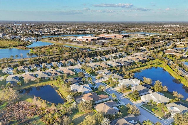 bird's eye view with a water view and a residential view