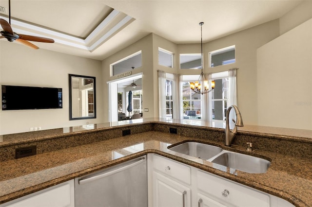8420 Sailing Loop, Lakewood Ranch, FL 34202 - kitchen with dishwasher, a sink, ceiling fan, white cabinetry, and dark stone counters
