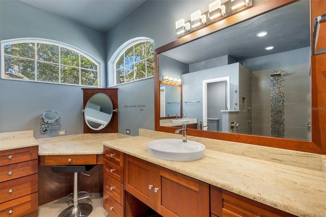 8420 Sailing Loop, Lakewood Ranch, FL 34202 - bathroom with a tile shower, vanity, and recessed lighting