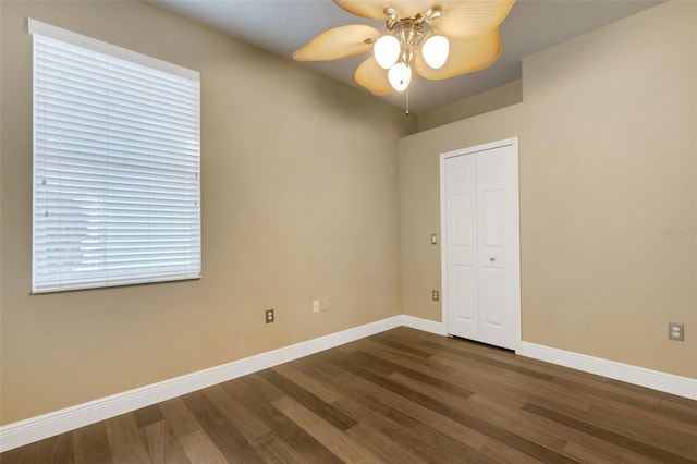 8420 Sailing Loop, Lakewood Ranch, FL 34202 - unfurnished room with dark wood-type flooring, ceiling fan, and baseboards