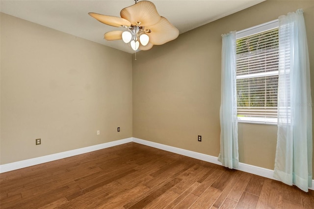 8420 Sailing Loop, Lakewood Ranch, FL 34202 - unfurnished room featuring wood finished floors, baseboards, and a ceiling fan
