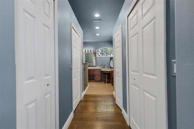 8420 Sailing Loop, Lakewood Ranch, FL 34202 - hall with dark wood finished floors, recessed lighting, a textured ceiling, and an office area
