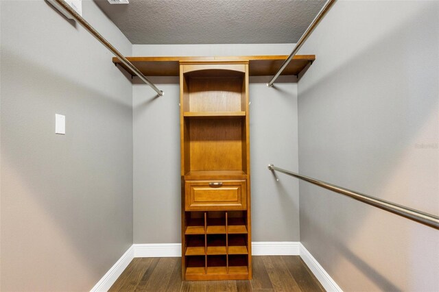 8420 Sailing Loop, Lakewood Ranch, FL 34202 - walk in closet featuring dark wood finished floors