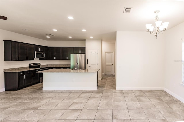 kitchen with stainless steel appliances, recessed lighting, visible vents, and light stone countertops