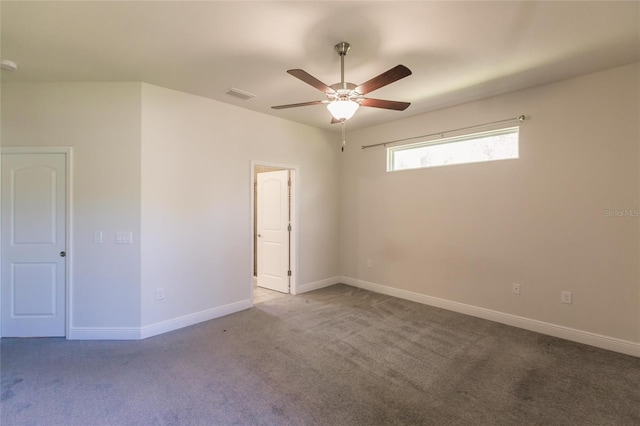 unfurnished room featuring a ceiling fan, carpet, visible vents, and baseboards