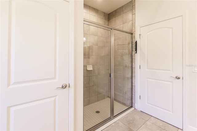 bathroom featuring a stall shower and tile patterned flooring