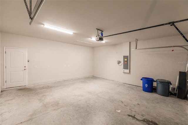 garage with electric panel and a garage door opener