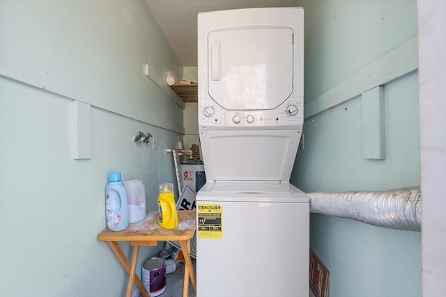 laundry area with stacked washer and dryer