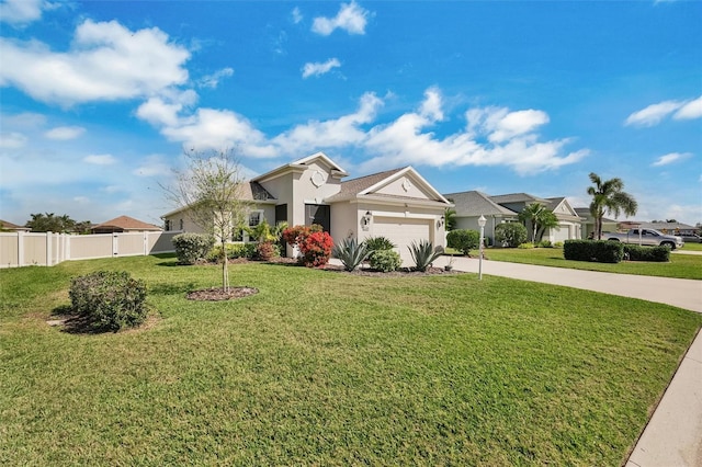 view of front facade with a garage, concrete driveway, fence, a front lawn, and stucco siding