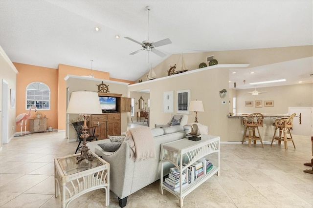 tiled living area with a ceiling fan, visible vents, vaulted ceiling, and baseboards