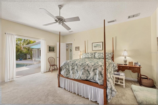 carpeted bedroom with a ceiling fan, access to outside, visible vents, and a textured ceiling