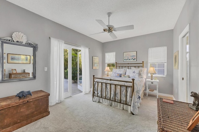 bedroom with access to exterior, carpet, a ceiling fan, and a textured ceiling