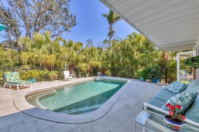 view of pool featuring a fenced in pool, a patio area, and a fenced backyard