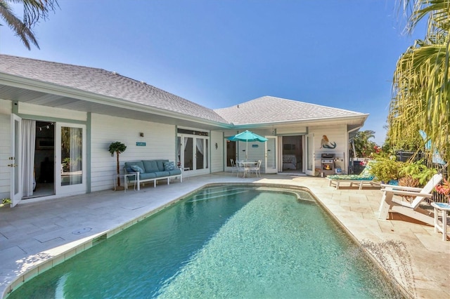 outdoor pool featuring a patio area