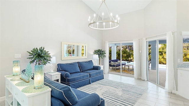 living area featuring high vaulted ceiling and a notable chandelier