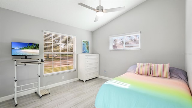 bedroom with wood tiled floor, multiple windows, baseboards, and vaulted ceiling