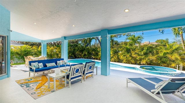 outdoor pool with a patio area, an outdoor living space, and an in ground hot tub