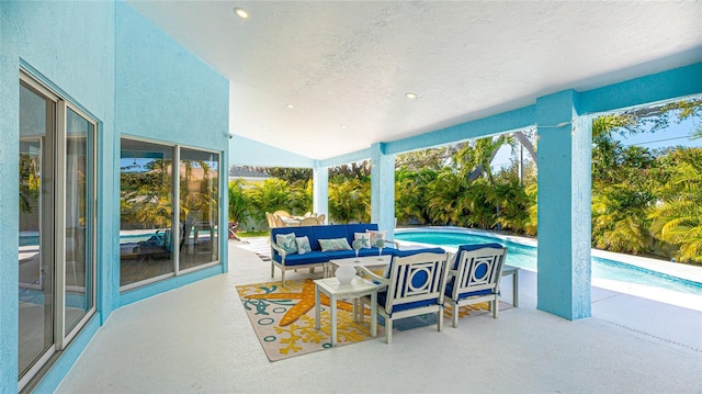 view of patio featuring an outdoor pool and an outdoor living space