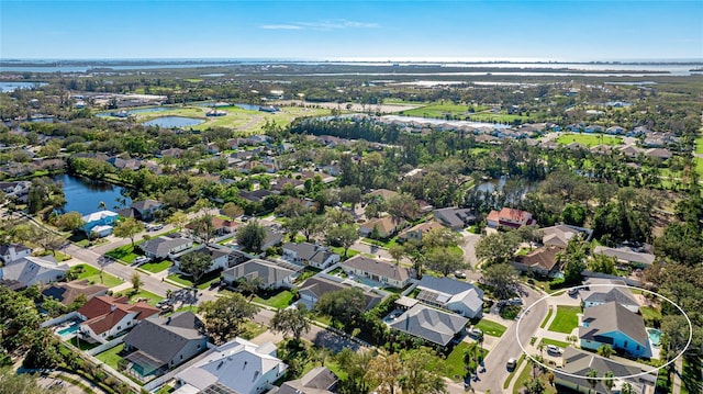 bird's eye view with a residential view and a water view