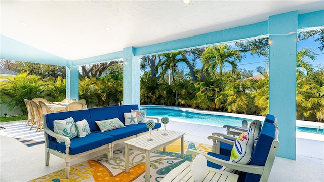 pool featuring a patio and an outdoor living space