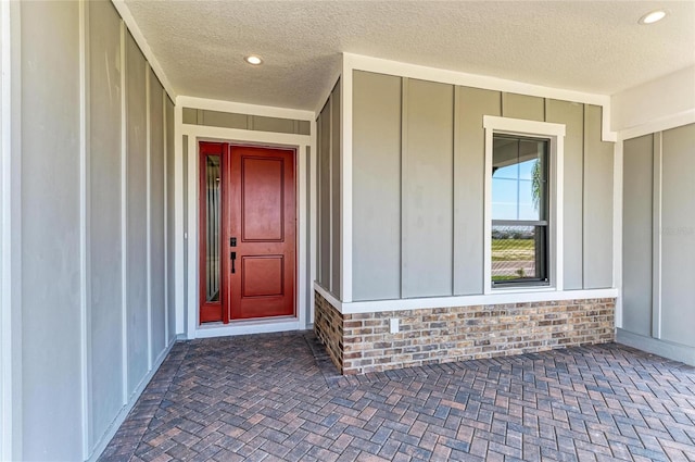 property entrance with board and batten siding