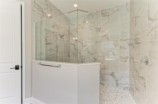 bathroom with recessed lighting and a walk in shower