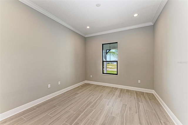 empty room with ornamental molding, light wood-style floors, recessed lighting, and baseboards