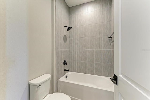 bathroom featuring toilet and shower / bathtub combination