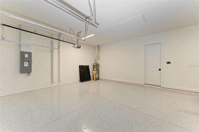 garage with a garage door opener, concrete block wall, electric panel, and water heater