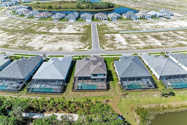 bird's eye view with a water view and a residential view