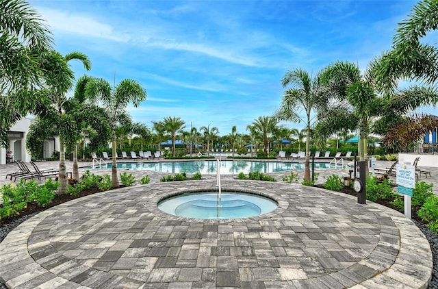 pool featuring a patio area and a hot tub