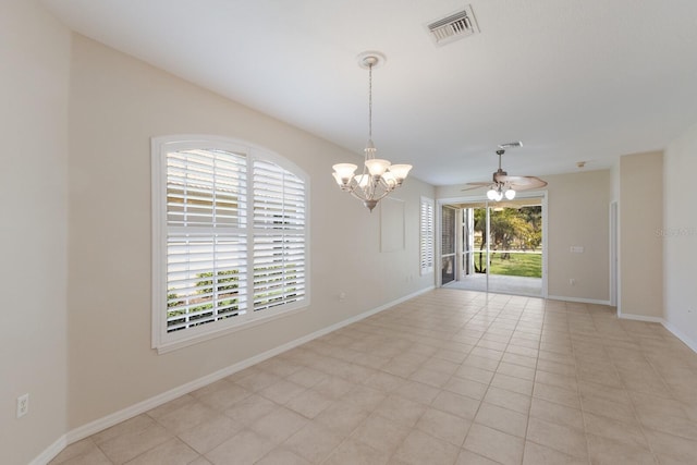 spare room featuring baseboards, visible vents, and ceiling fan with notable chandelier