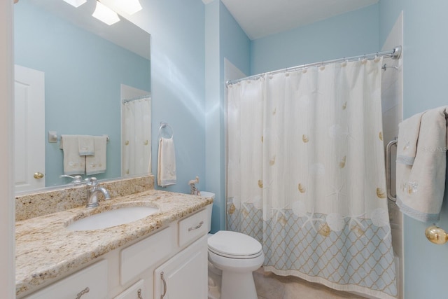 bathroom featuring toilet, curtained shower, tile patterned flooring, and vanity