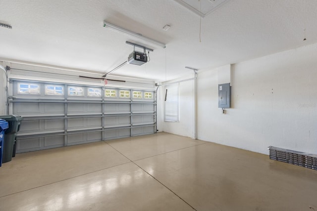 garage with electric panel and a garage door opener