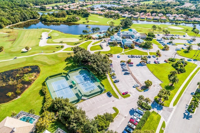 bird's eye view with a water view and golf course view