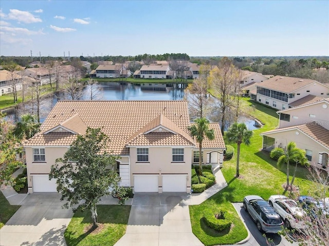 birds eye view of property featuring a residential view and a water view