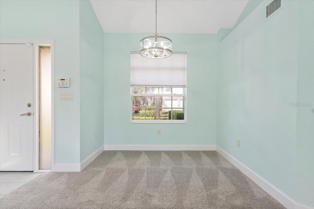 empty room featuring an inviting chandelier, carpet flooring, visible vents, and baseboards