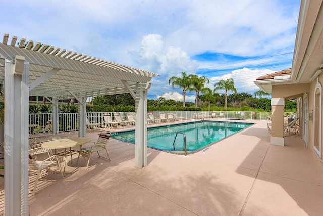 pool featuring a patio area, fence, and a pergola