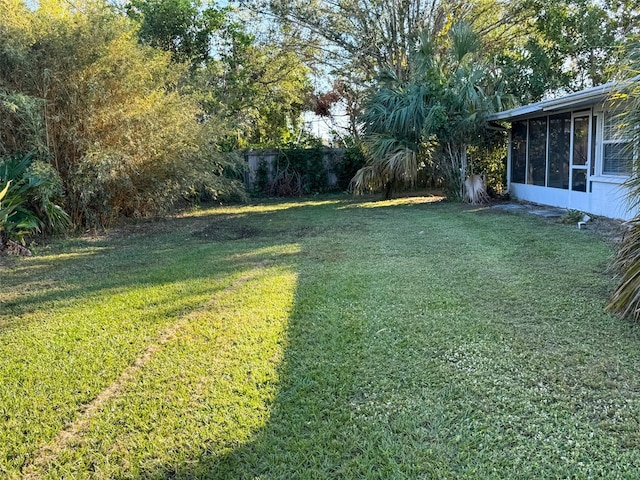 view of yard featuring a sunroom