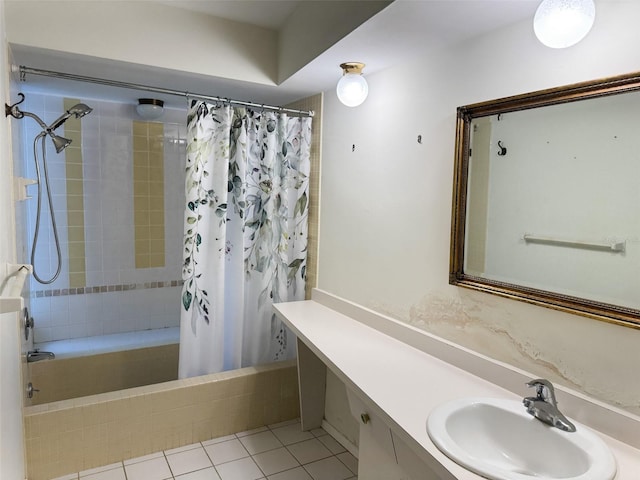 full bathroom with tile patterned flooring, tiled shower / bath, and vanity