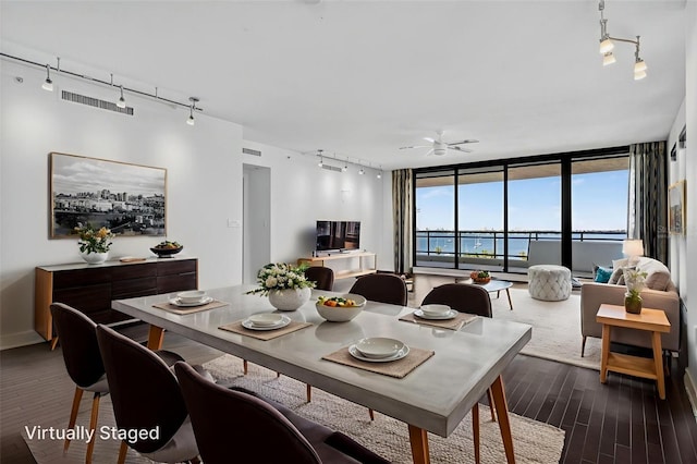 401 S Palm Ave Unit 801, Sarasota, FL 34236 - dining room featuring rail lighting, dark wood finished floors, ceiling fan, and a wall of windows