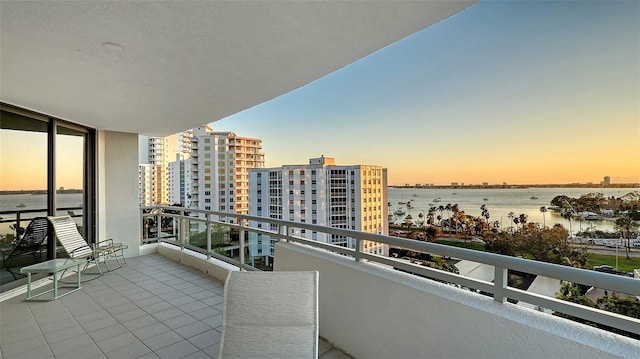 401 S Palm Ave Unit 801, Sarasota, FL 34236 - balcony at dusk with a water view