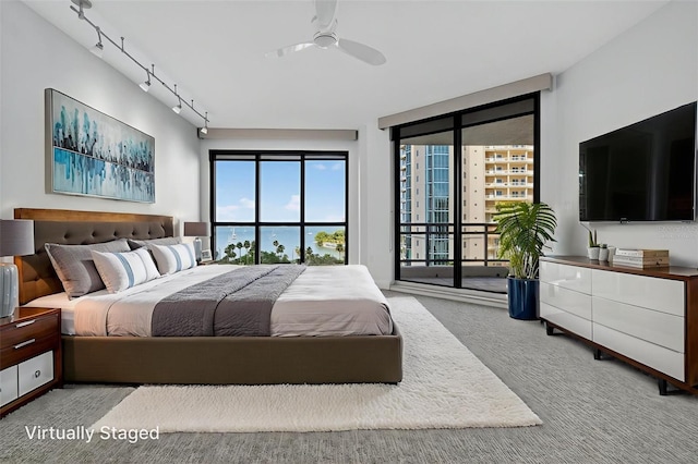 401 S Palm Ave Unit 801, Sarasota, FL 34236 - carpeted bedroom with access to exterior and ceiling fan