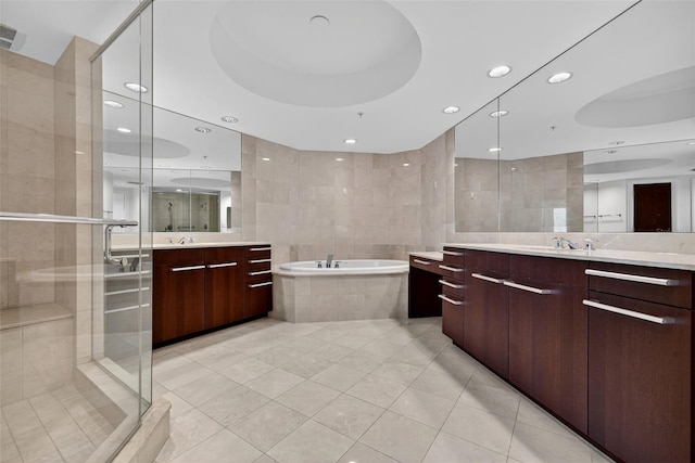 401 S Palm Ave Unit 801, Sarasota, FL 34236 - bathroom with tile patterned floors, two vanities, a garden tub, a stall shower, and recessed lighting