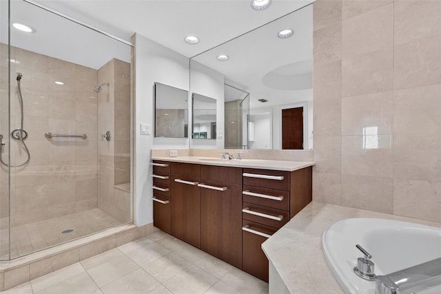 401 S Palm Ave Unit 801, Sarasota, FL 34236 - full bathroom featuring tile patterned floors, a stall shower, vanity, a bath, and recessed lighting