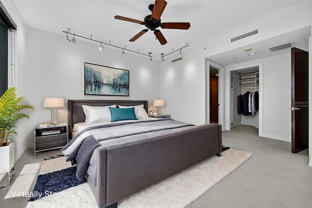 401 S Palm Ave Unit 801, Sarasota, FL 34236 - bedroom featuring light colored carpet, track lighting, a closet, and a ceiling fan