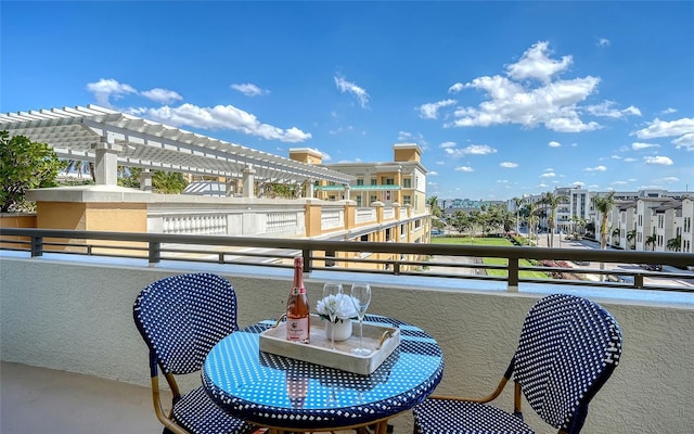 balcony featuring a pergola