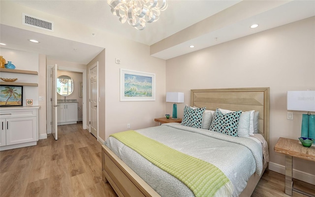 bedroom with recessed lighting, visible vents, light wood-style floors, a chandelier, and baseboards