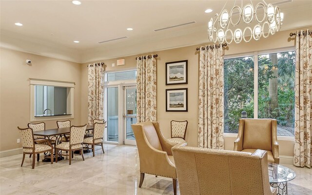 sitting room featuring ornamental molding, visible vents, and plenty of natural light